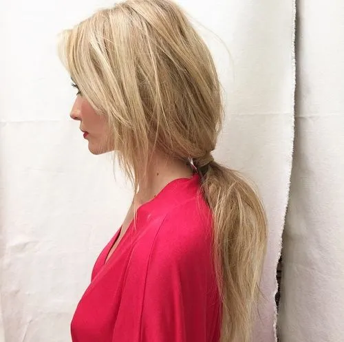 A low, loose ponytail tied well below the crown