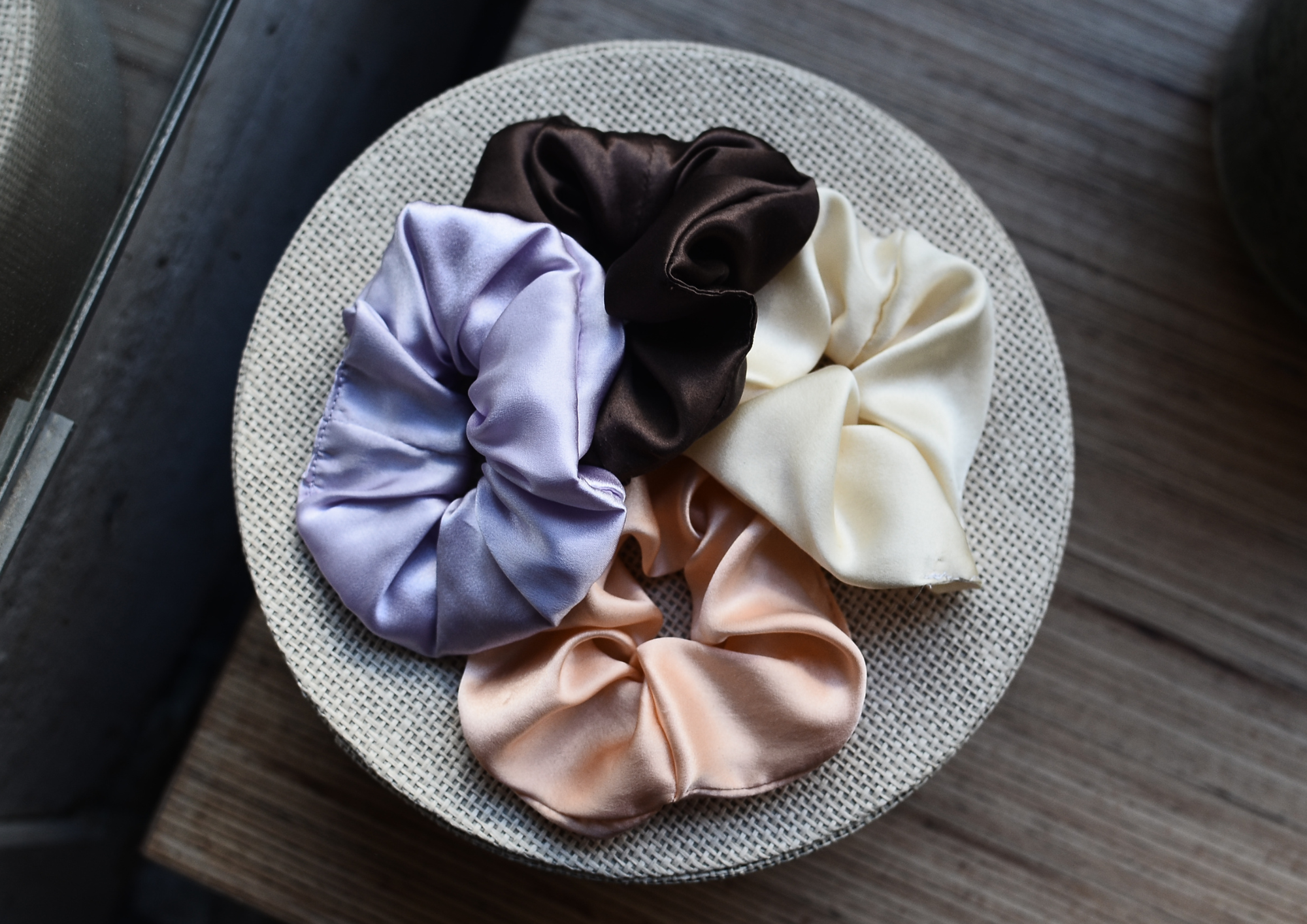 Silk and satin scrunchies hold hair without the snag or pressure point of a traditional elastic.