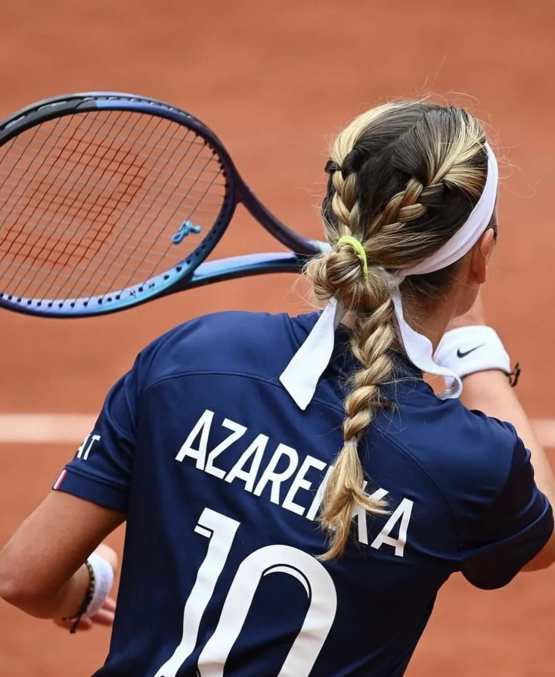 Boxer braids tied off with bright elastics