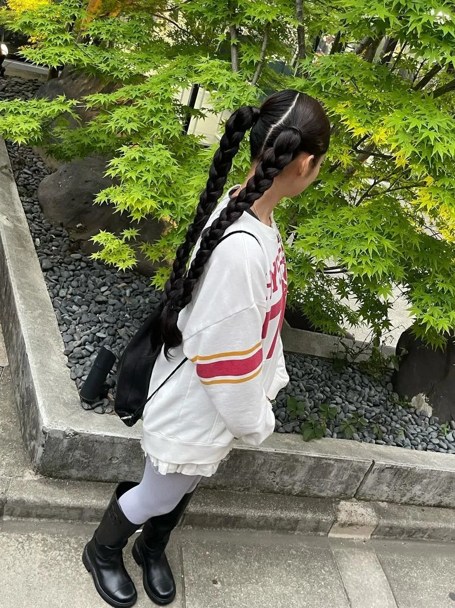 Double Braided ponytail on textured hair with beaded ends