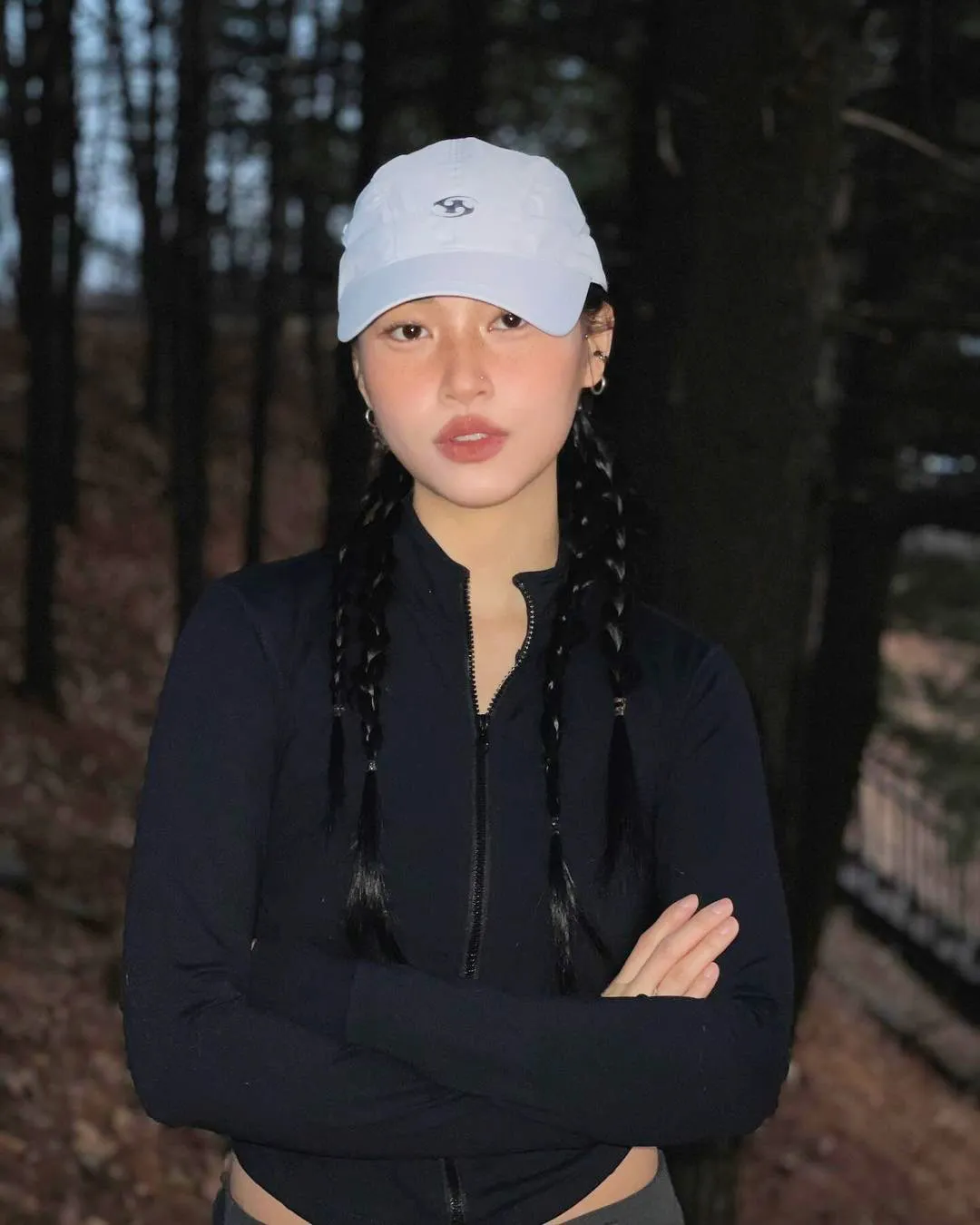 Braided ponytail worn under a cap