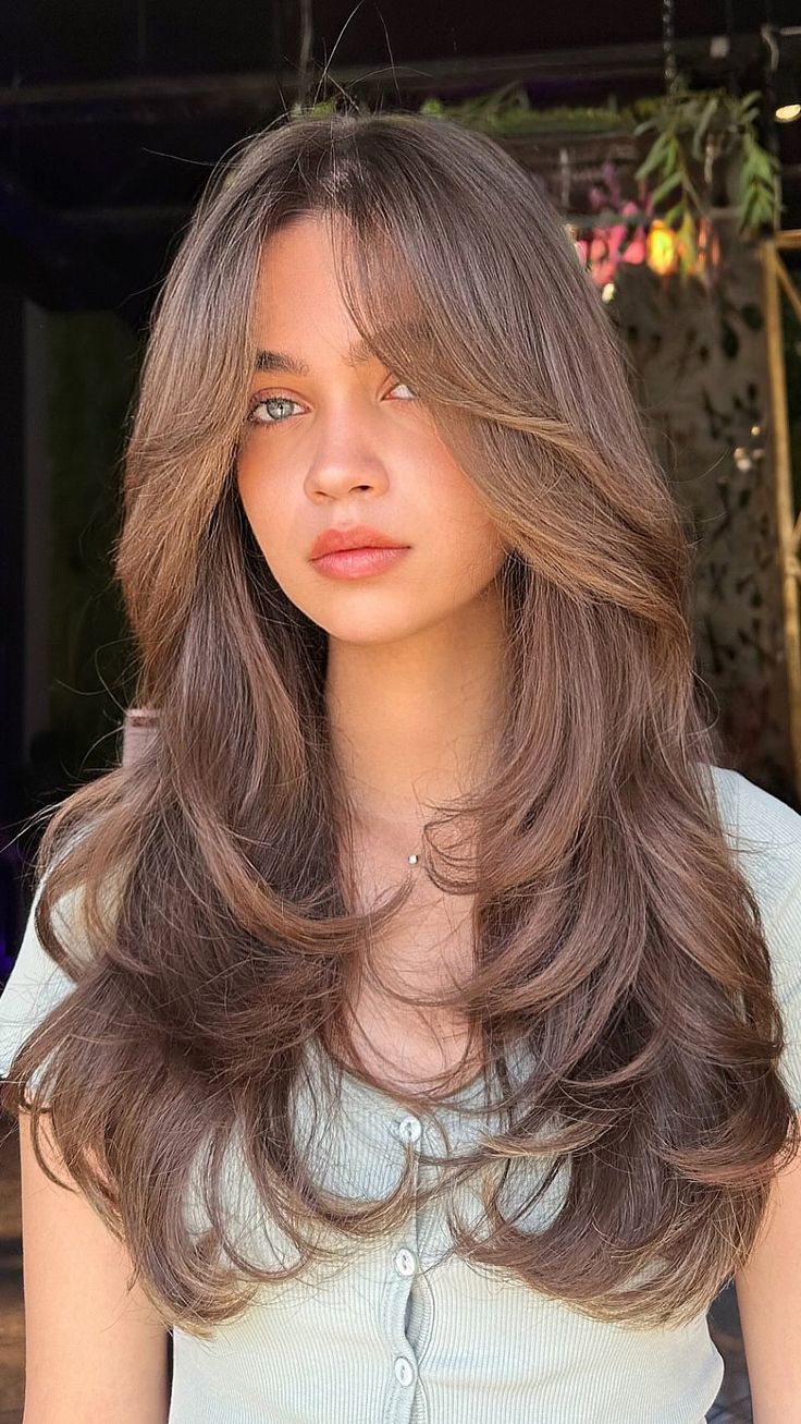 Curtain bangs can create the illusion of a smaller face, but require styling to hold shape.