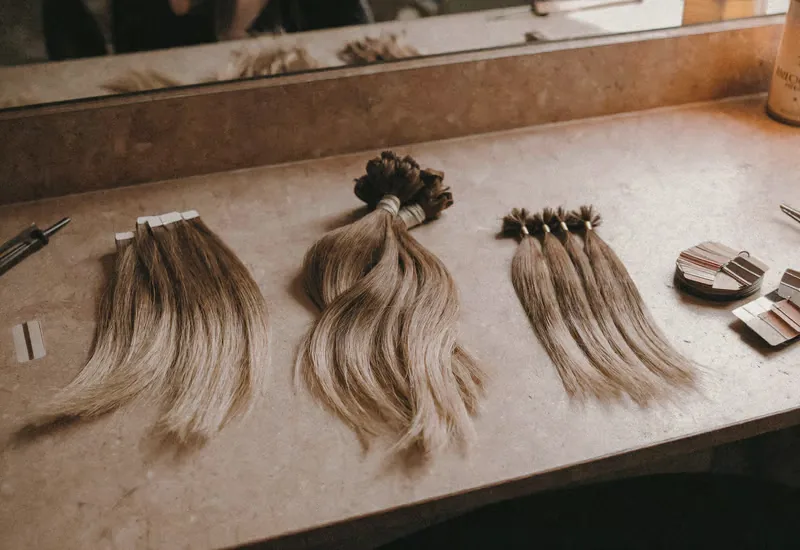 Tape-ins, hand-tied wefts, K-tips, and clip-ins are not the same product in different packaging. The right method depends entirely on your hair.