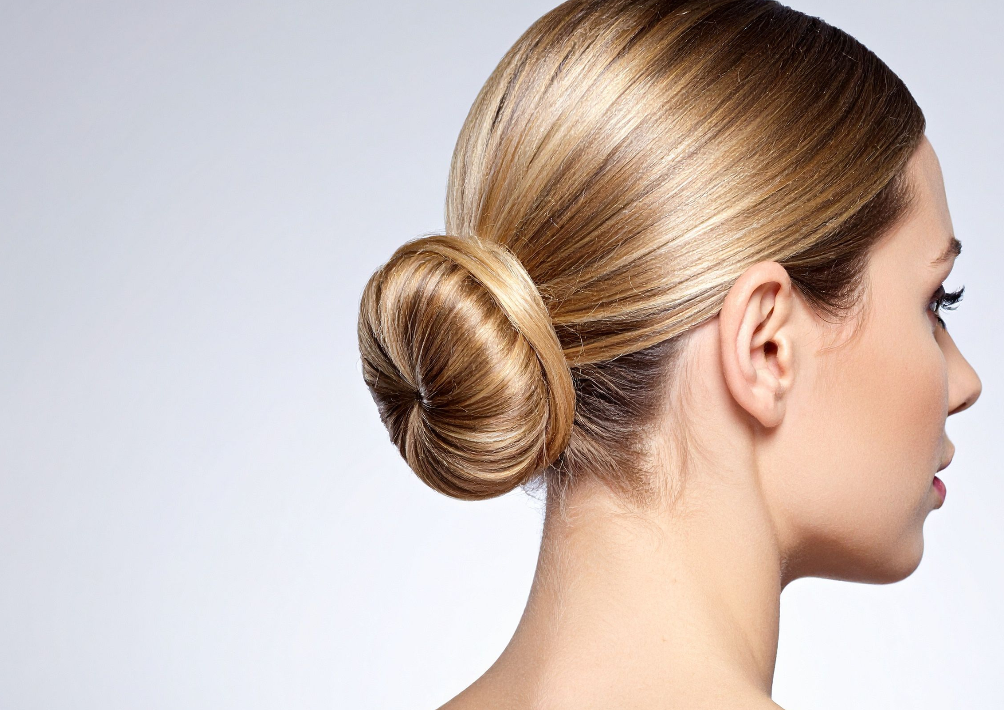 A sleek, polished low bun