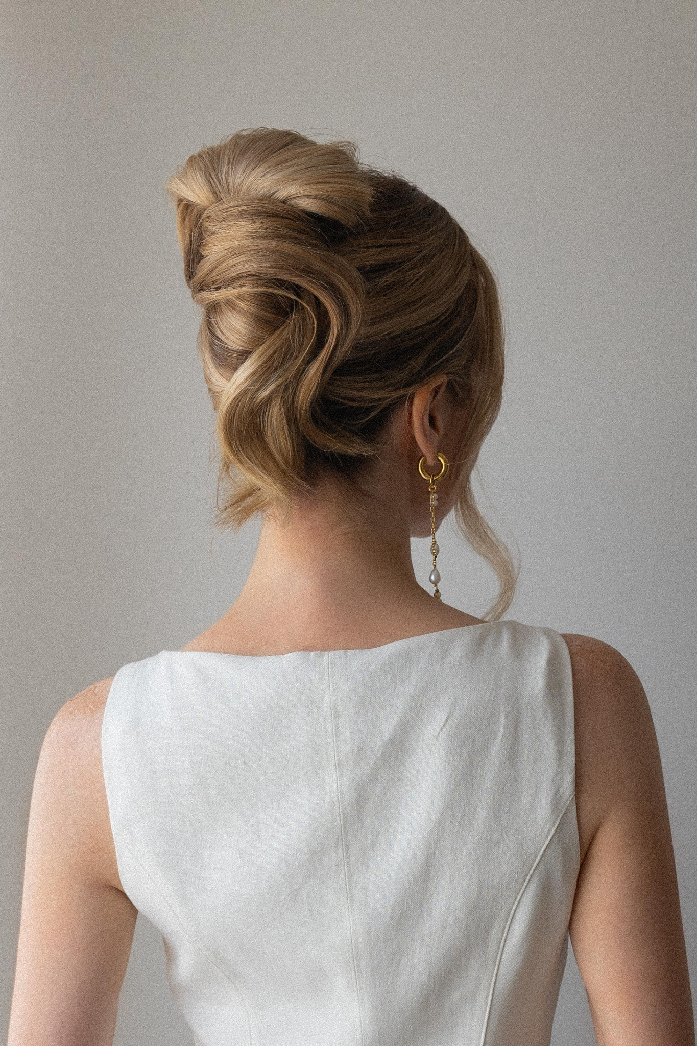 A soft twisted updo with loose face-framing pieces