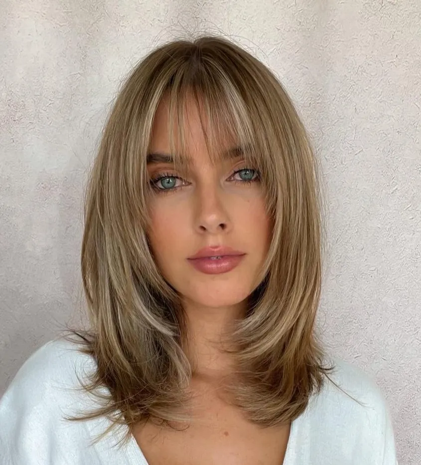 Straight hair with soft layers framing the face