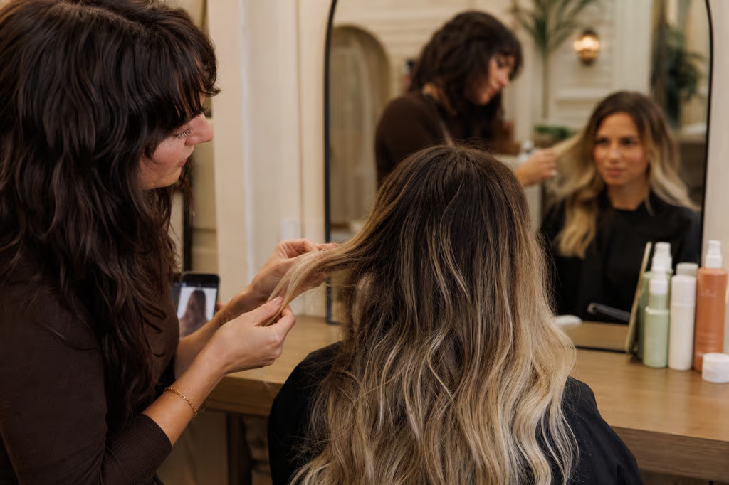 A stylist who asks to feel your hair and talks through the specific wave you want is showing you they know what they are doing.