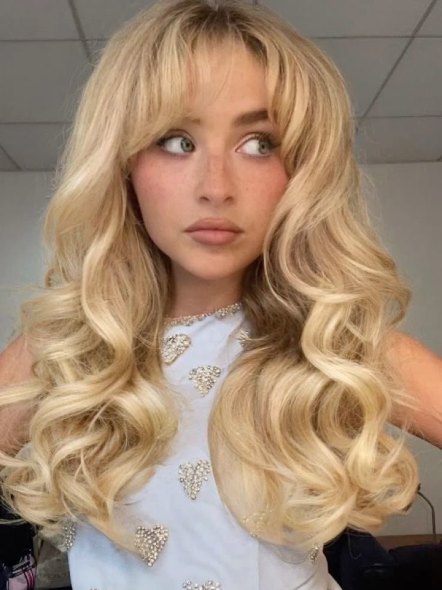 Brushed-out curls with root lift