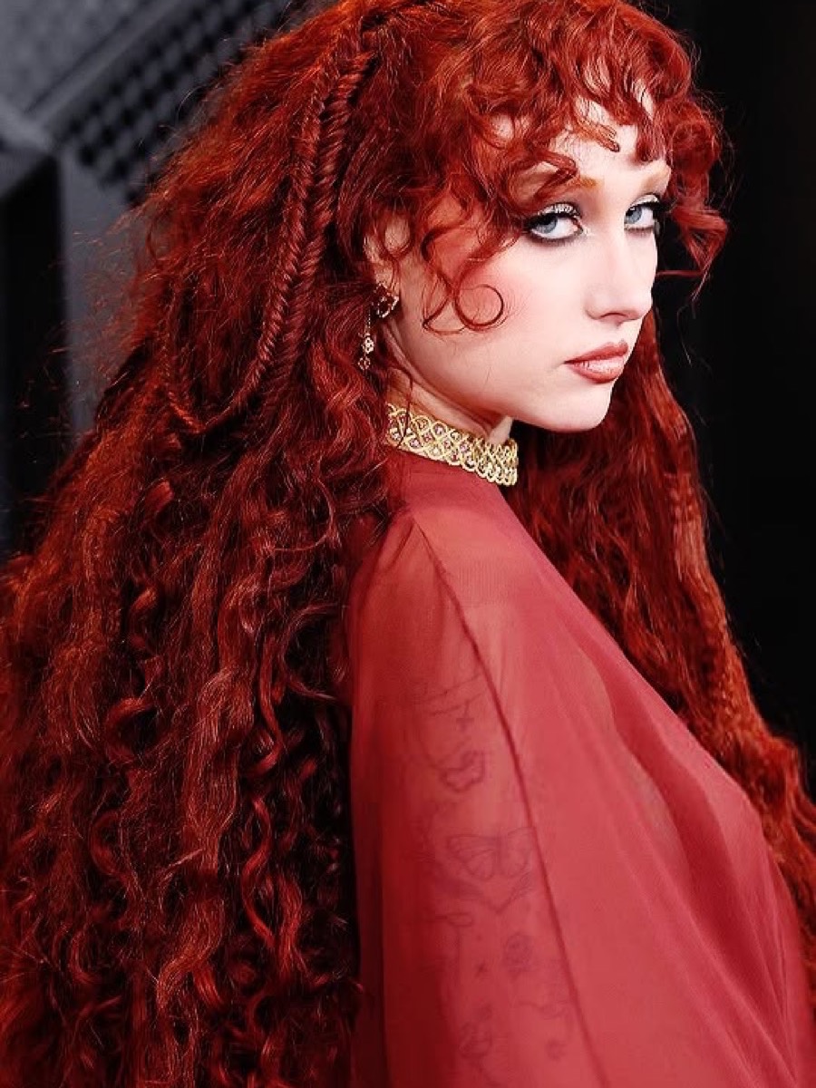 Towering curls and teased volume on stage